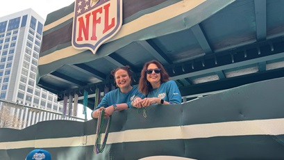 Kathy Sharp (right) and her daughter tossed beads from a parade float honoring the Philadelphia Eagles™ at the 2025 Super Bowl™ in New Orleans.