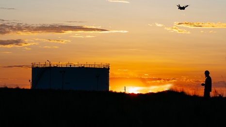 drone flying at sunset