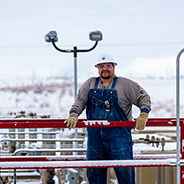 worker holding on to railing at infrastructure site